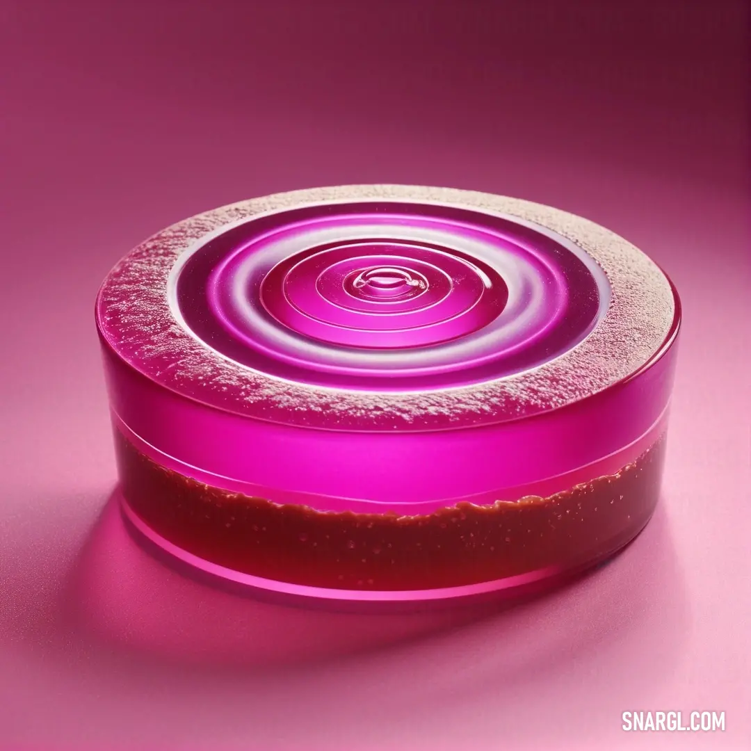 Hot magenta color. Pink container with a circular design on it's lid and a pink background