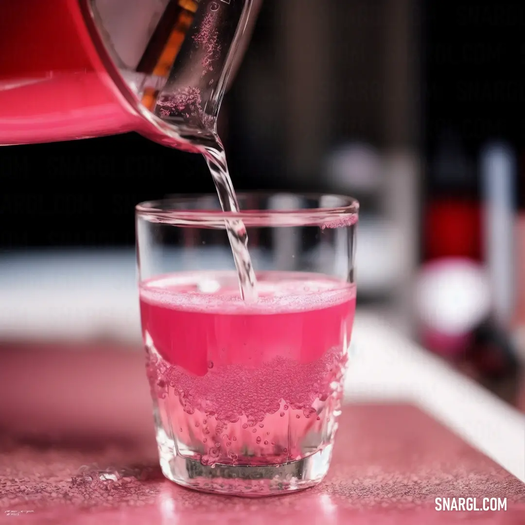 Glass of water being poured into a glass of pink liquid with a pink substance in it. Color CMYK 0,59,29,0.