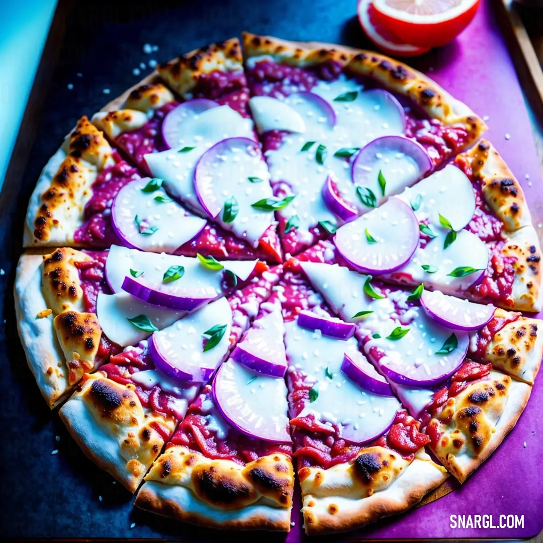 Pizza with sliced up radishes on a purple tray next to a lemon and a glass of orange juice