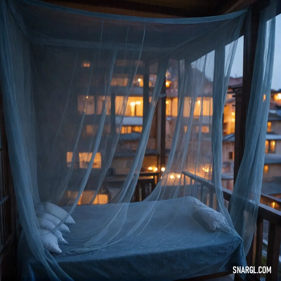 An inviting hotel room showcases a cozy bed with an elegant canopy, all set against the enchanting backdrop of a nighttime cityscape, where twinkling lights paint a mesmerizing scene outside the window.