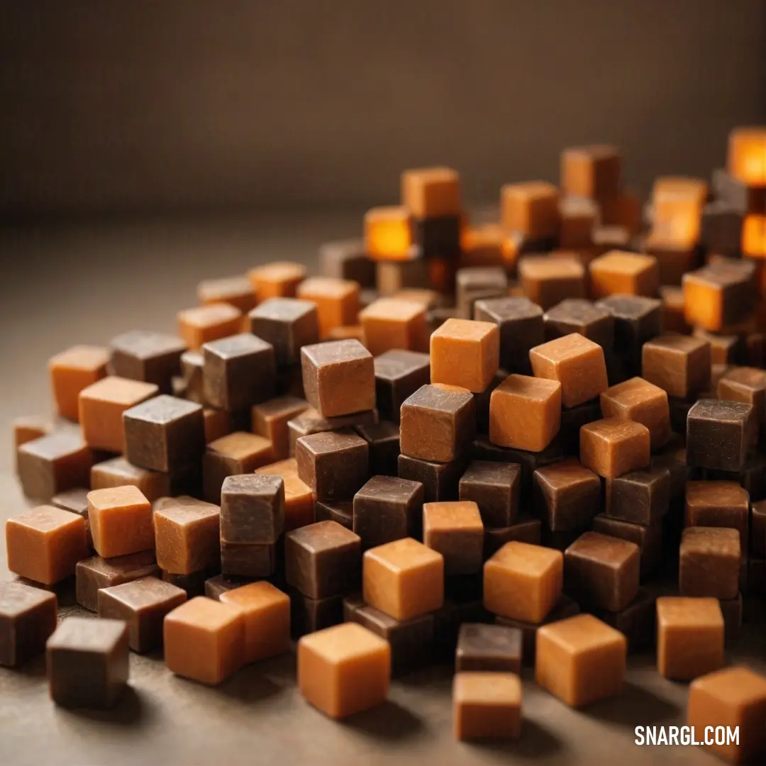 An inviting arrangement of rich chocolate cubes elegantly sits on a table beside a warm cup of coffee and a silver spoon. This delicious display evokes a sense of comfort and indulgence, perfect for a cozy afternoon.