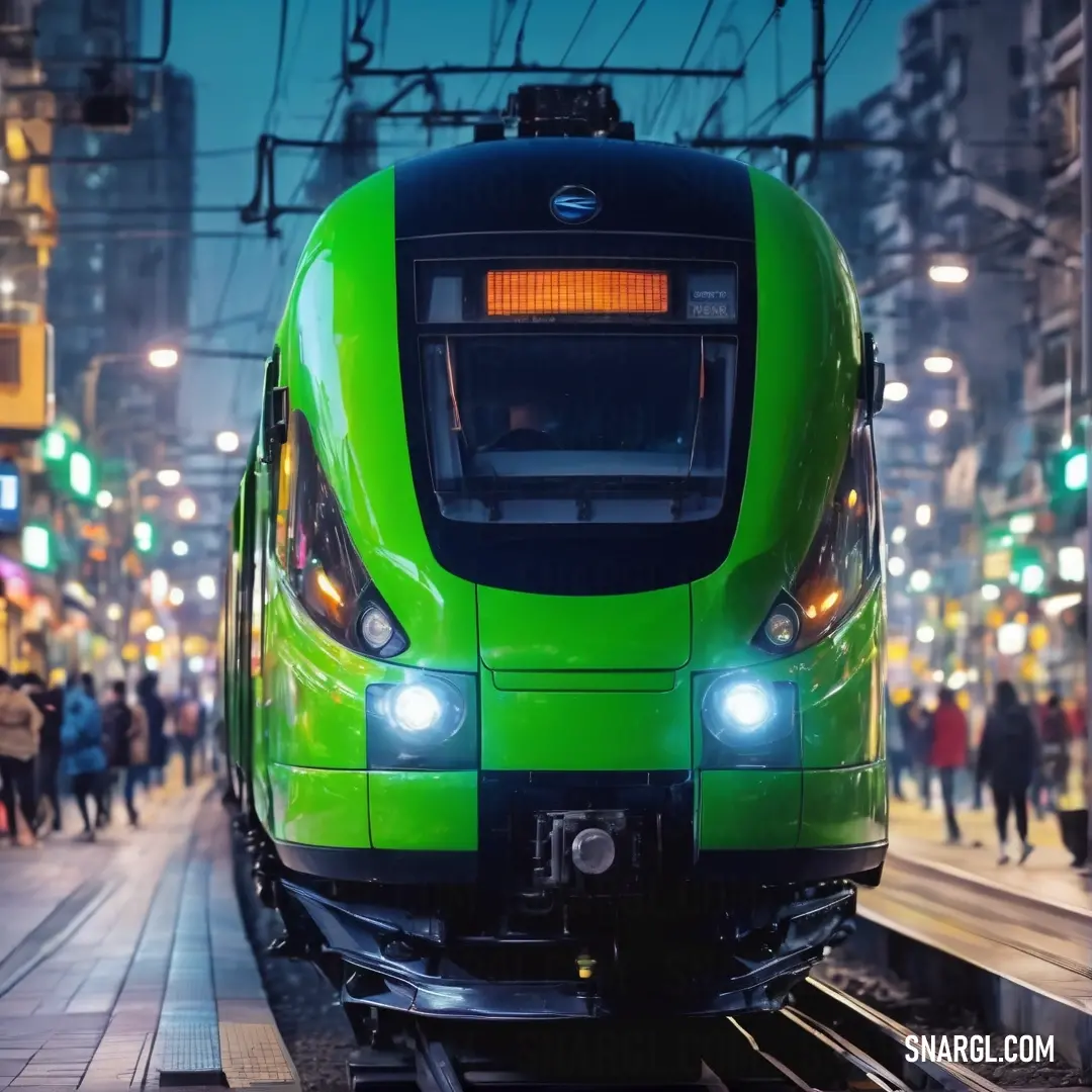 Islamic green color. Green train is on the tracks in a city at night time with people walking around it