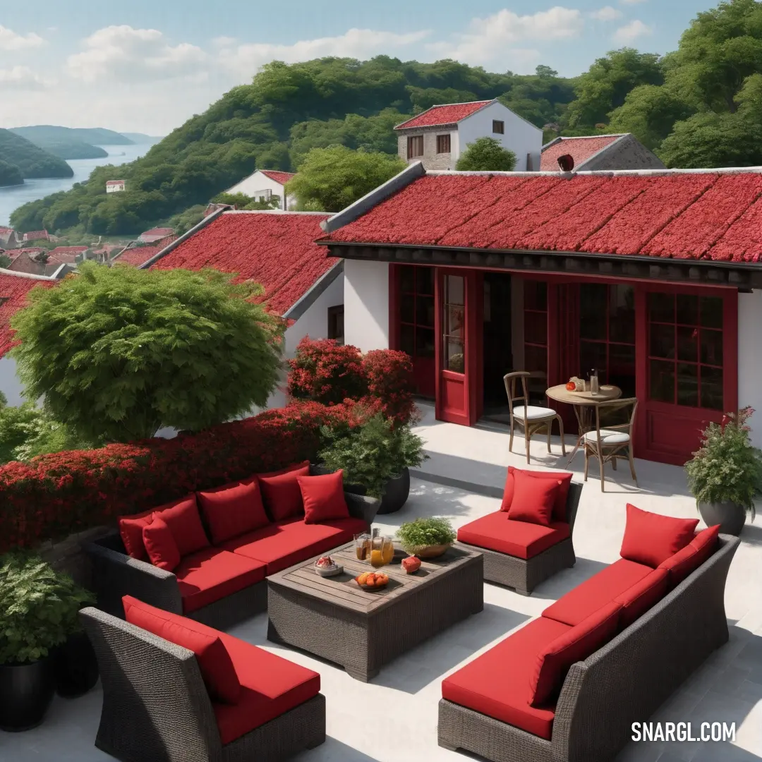 Patio with a table and chairs and a red roof and red cushions on it and a view of a lake. Color RGB 215,59,62.