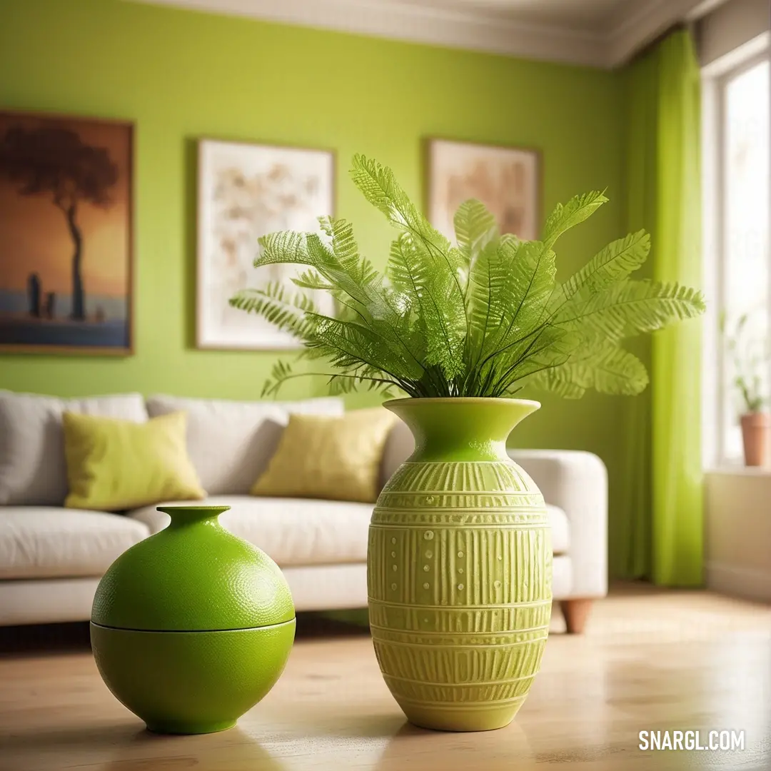 June bud color example: Green vase and a green container on a table in a room with green walls and a couch in the background