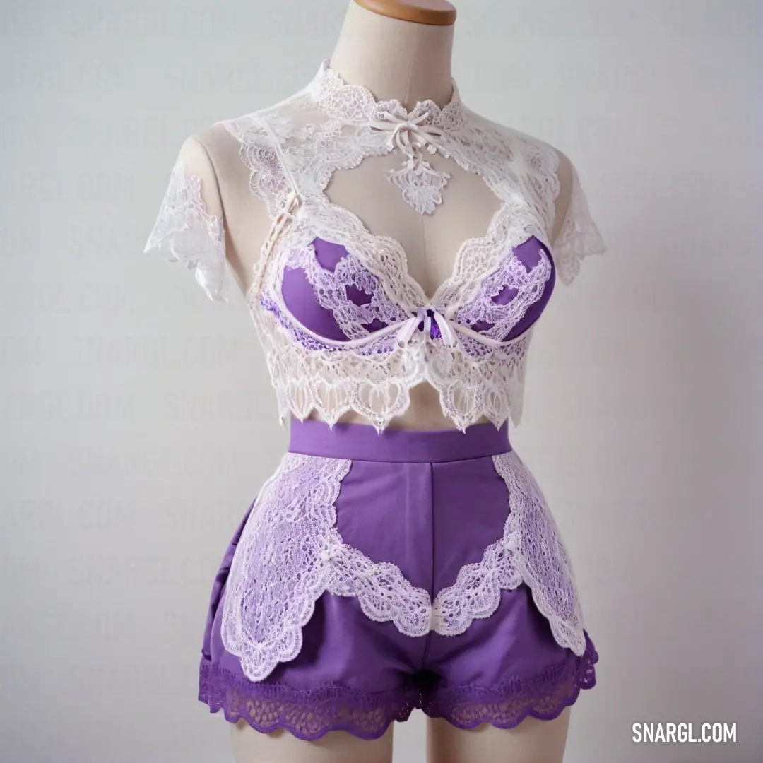 Mannequin wearing a purple and white lingerie with lacy bra and shorts on display in a store