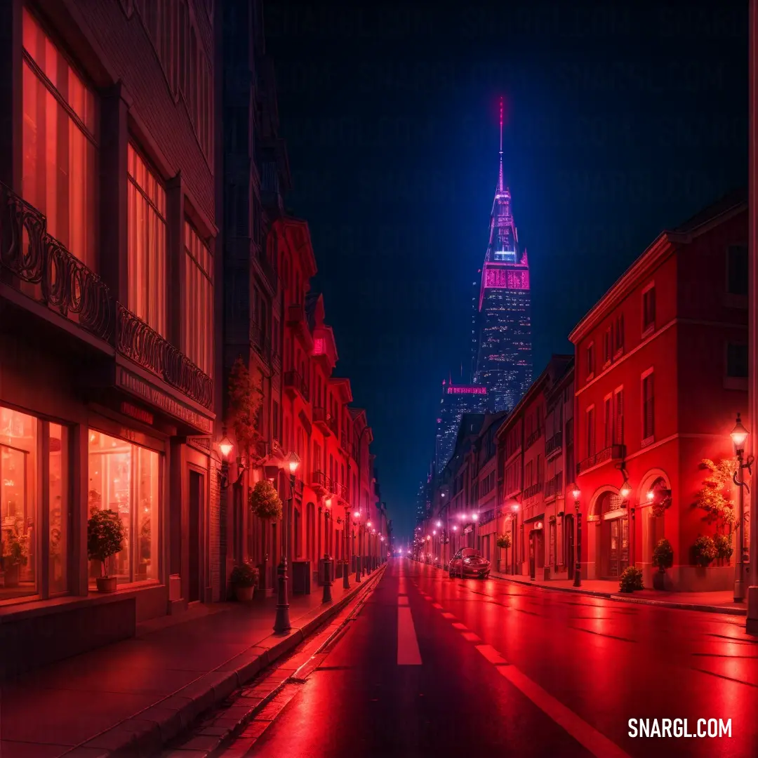 City street with a red light at night and a tall building in the background with a spire lit up