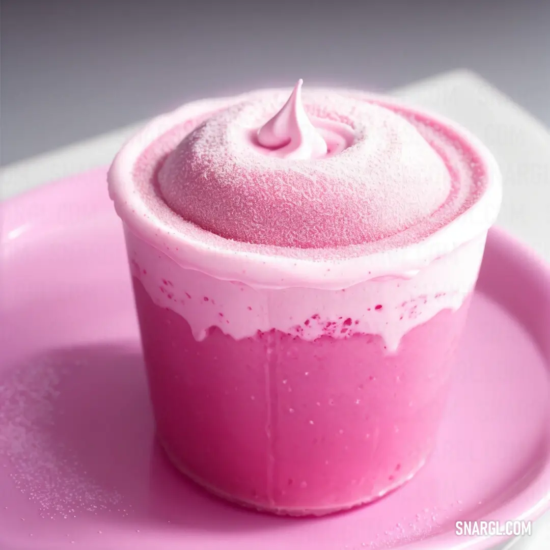 Pink cupcake with a pink frosting on top of it on a pink plate with a white table cloth