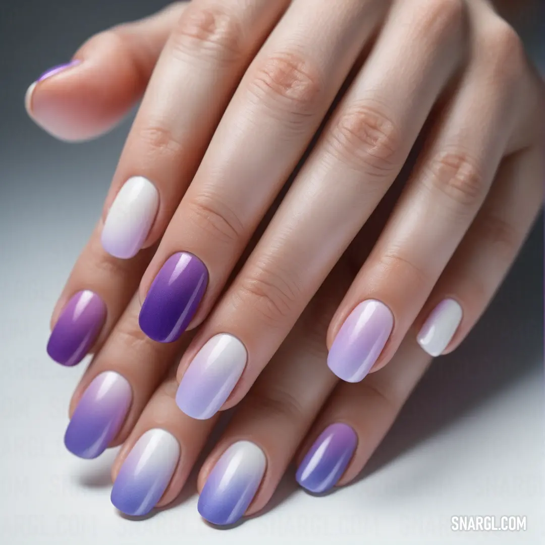 Woman's hands with purple and white nail polishes on them. Color Lavender.
