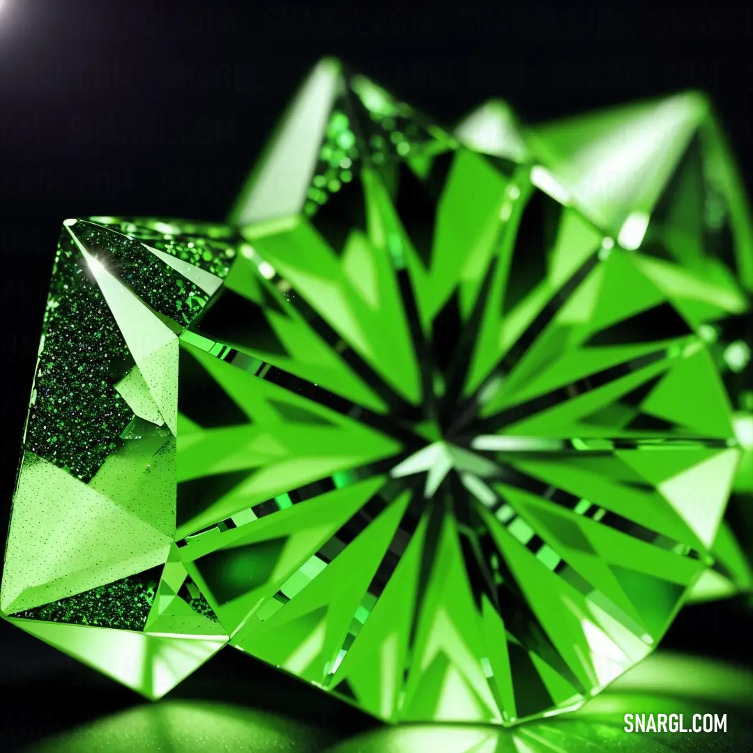 Green diamond is shown in the dark light of the image, with a black background. Example of Lawn green color.