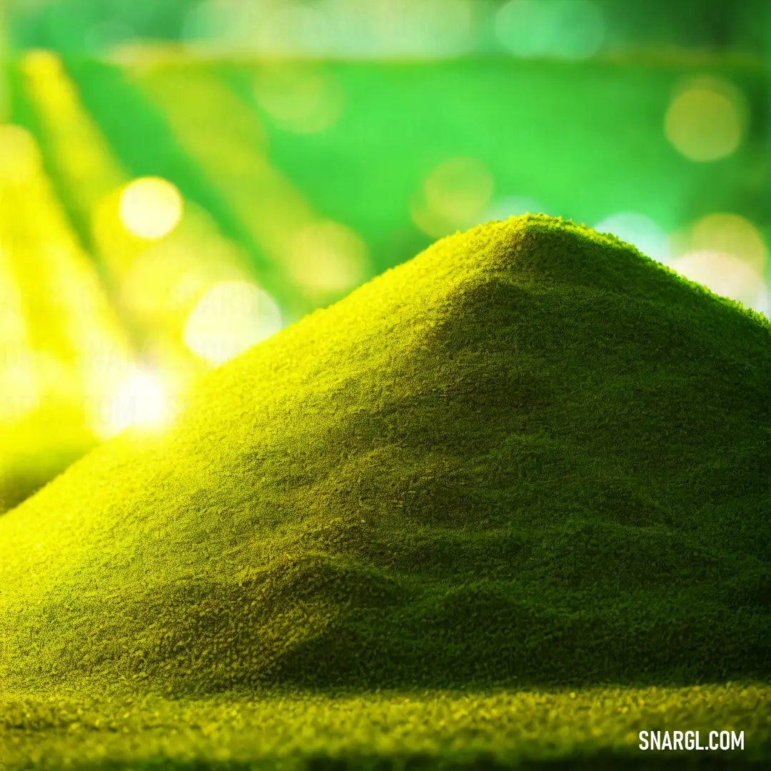 Pile of green grass on top of a table next to a green wall