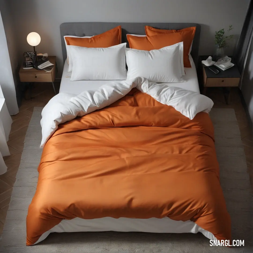 Bed with a white and orange comforter and pillows on it and a lamp on the side of the bed. Example of #B5651D color.