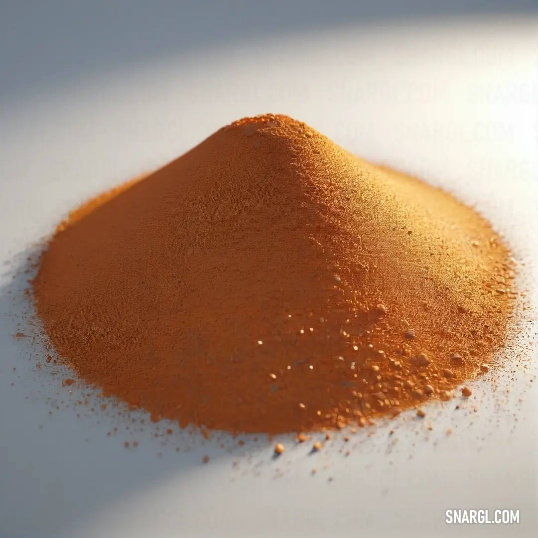 Pile of orange powder on a white surface. Example of RGB 181,101,29 color.