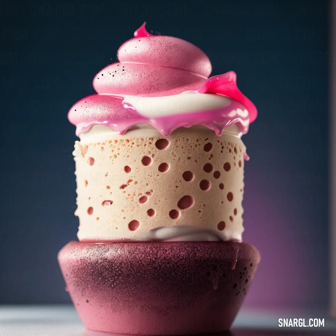 Pink and white cupcake with a pink bow on top of it's top
