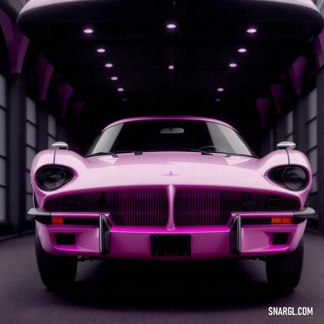 Pink car parked in a garage with a purple light on it's side and a black floor