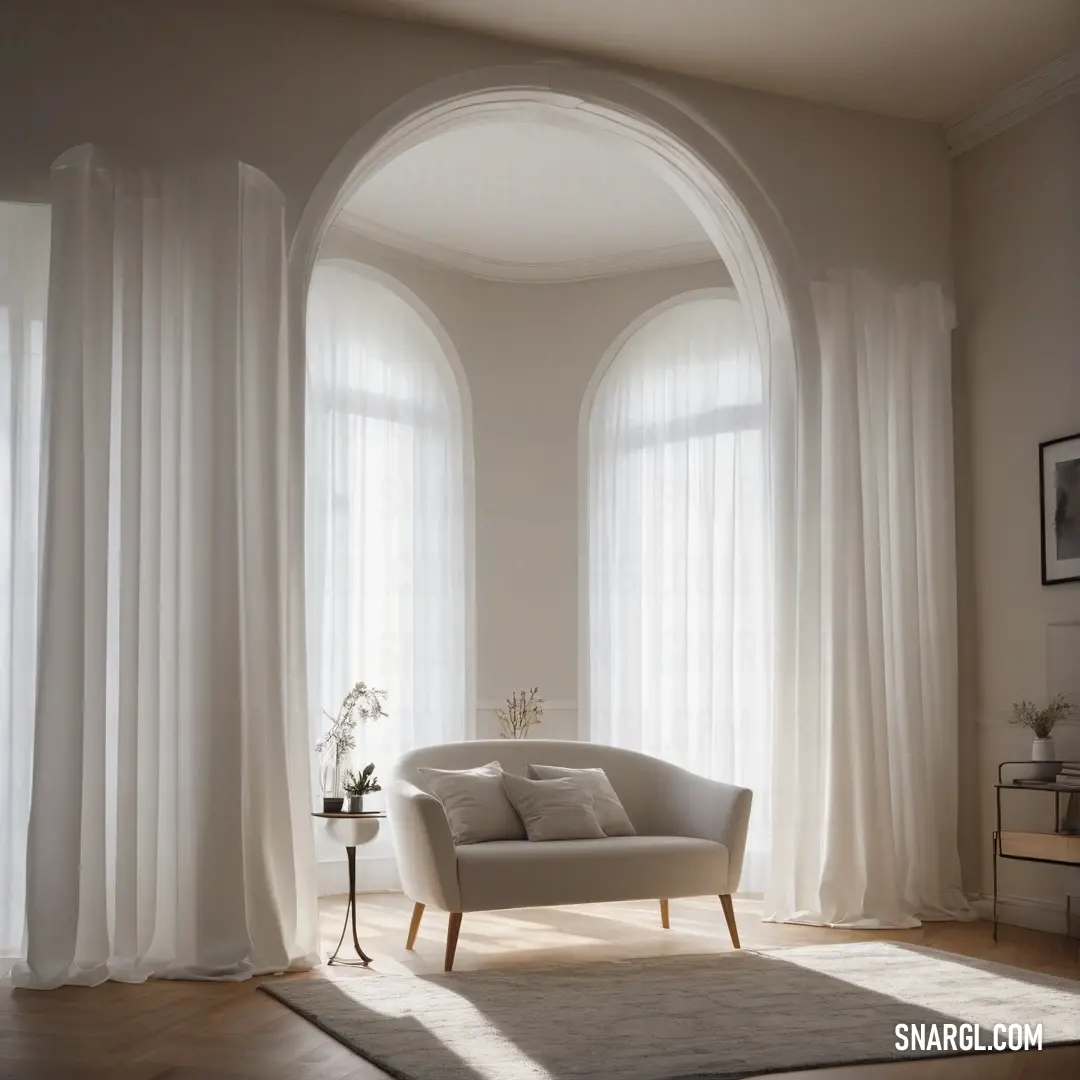 Light gray color. White chair in a living room next to a window with white curtains on it's sides
