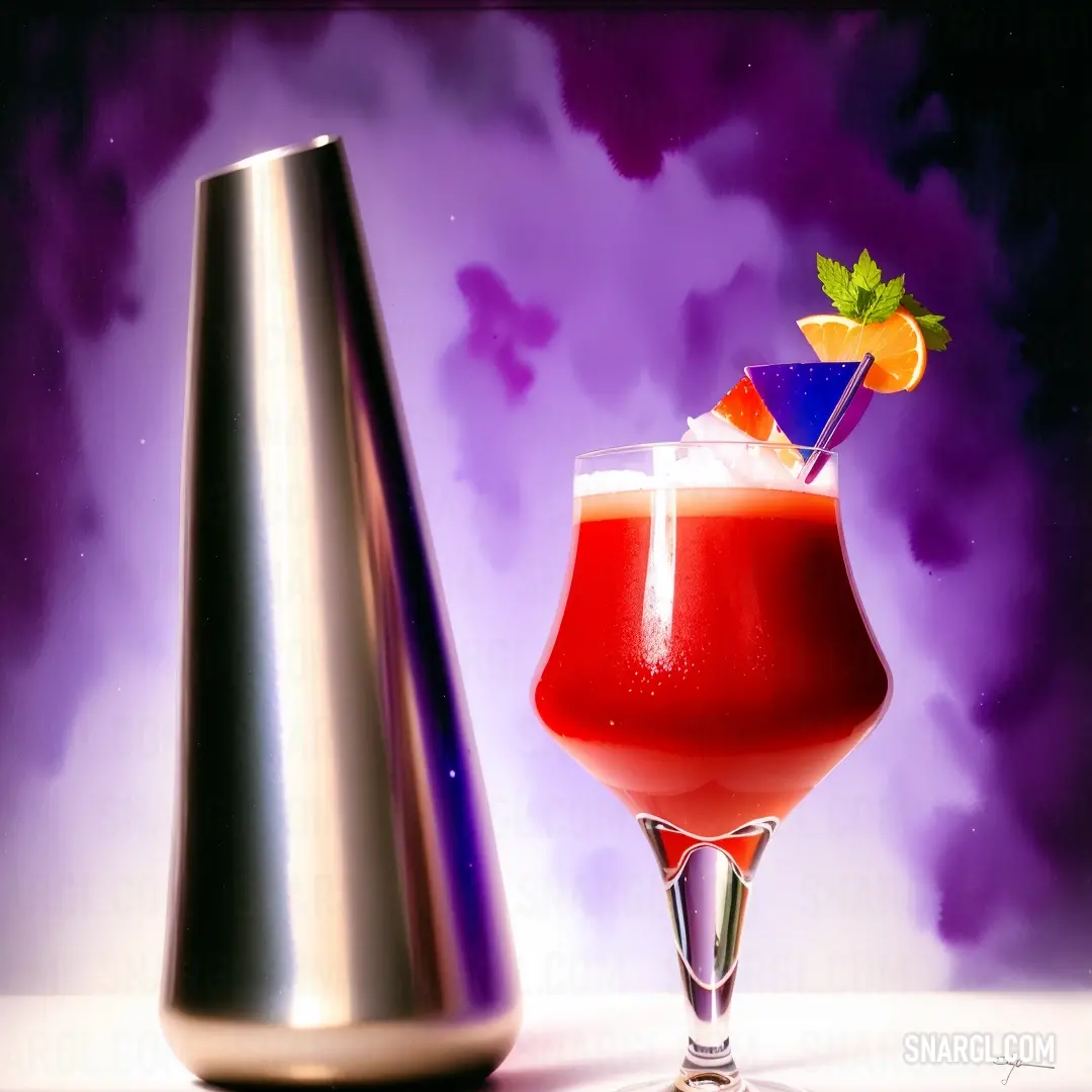 Red drink with a garnish garnish on top of it next to a silver vase