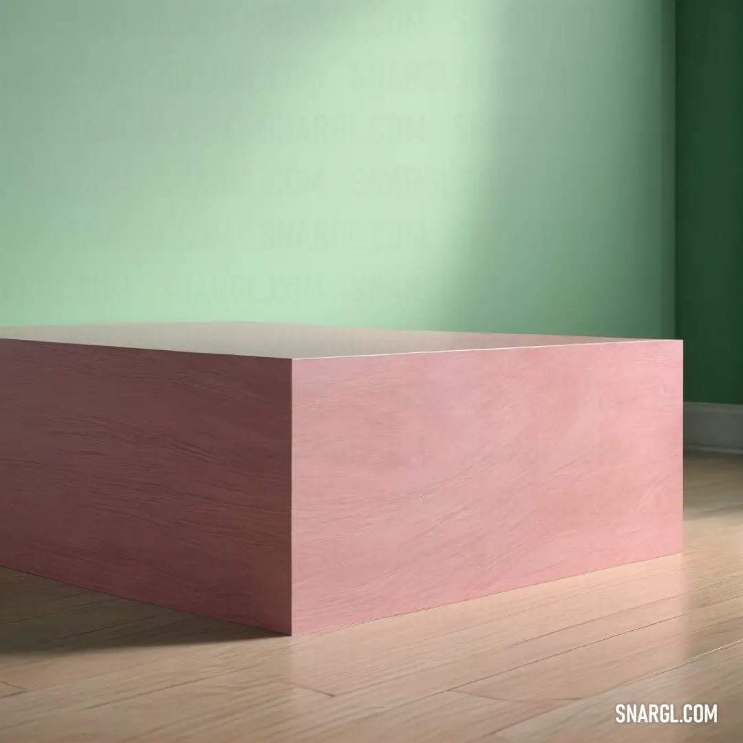 Pink box on top of a wooden floor in a room with green walls. Example of #FFB6C1 color.