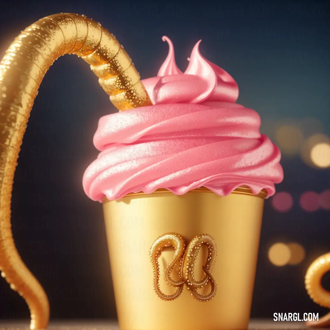 Cupcake with a gold ribbon and a pink frosting on it with a gold snake on top