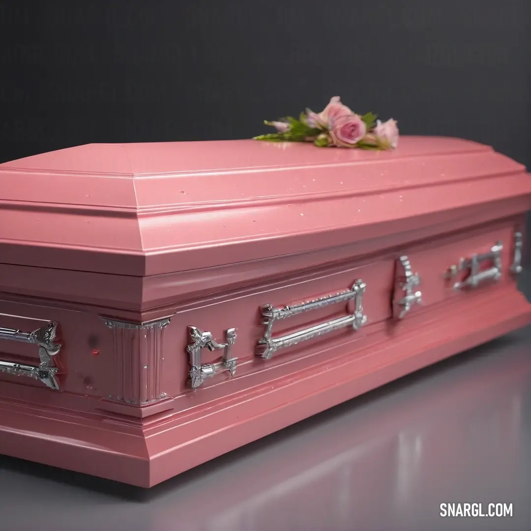 Pink casket with a rose on top of it on a table with a black background. Color #FF9999.