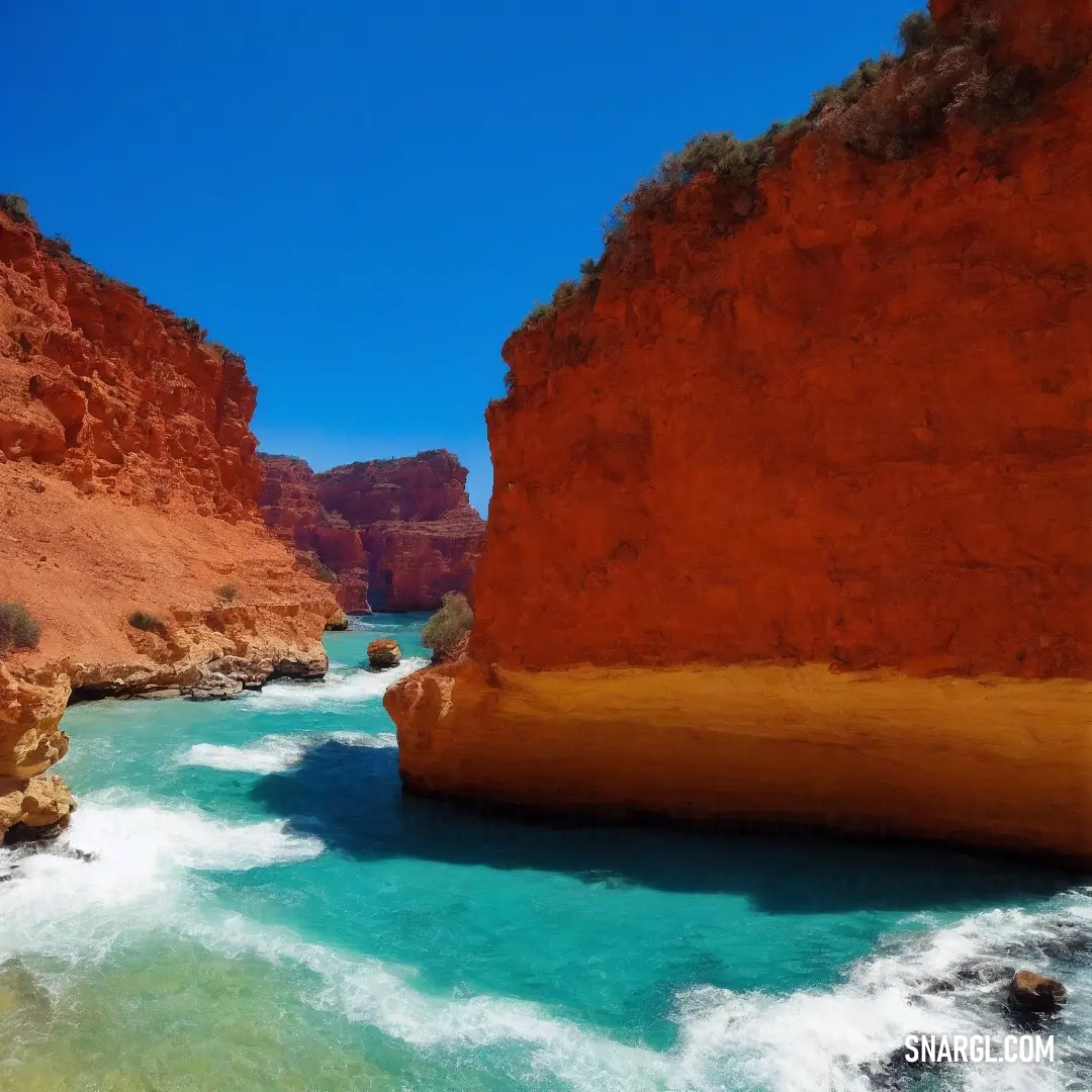 River flowing between two red cliffs in the desert