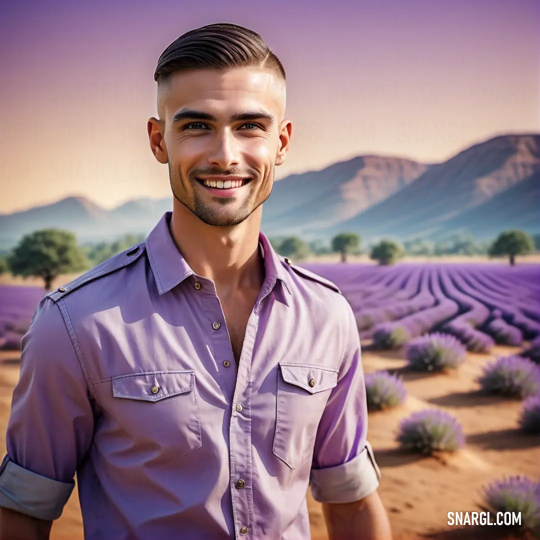 Man in a lavender field with mountains in the background. Example of RGB 200,162,200 color.