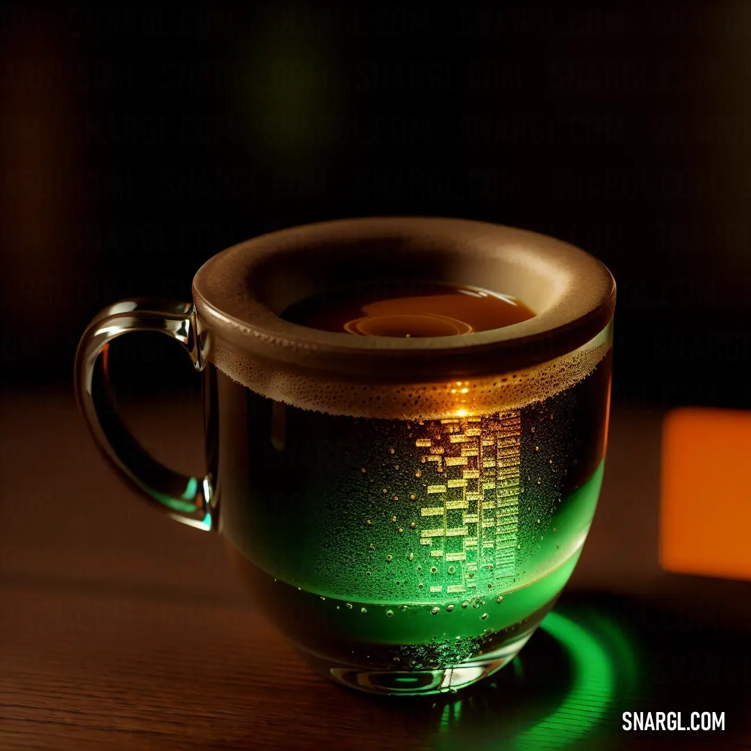 Cup of coffee with a green and yellow design on it on a table with a black background. Color Lime green.