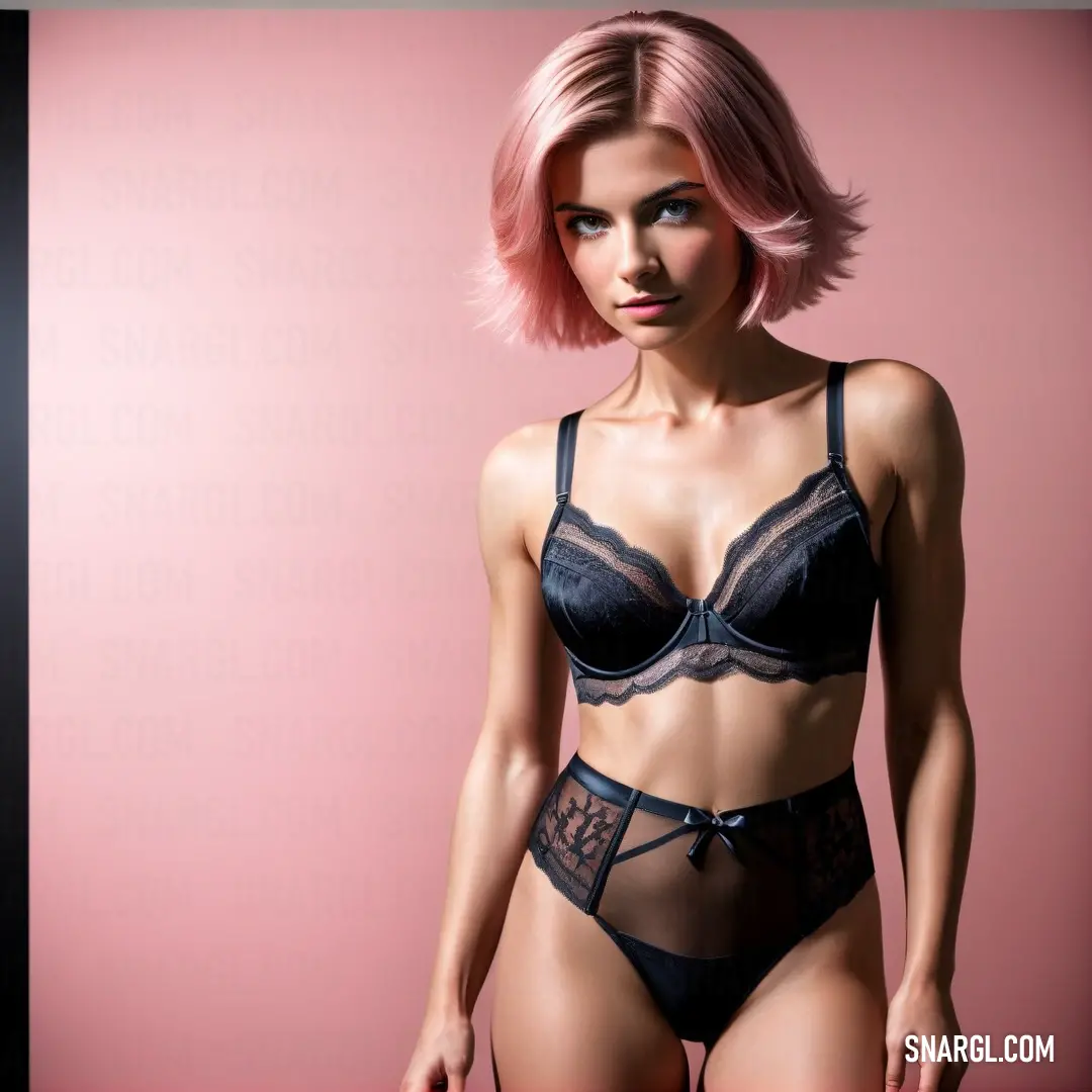 Woman in a black bra and panties posing for a picture with pink hair and a pink background