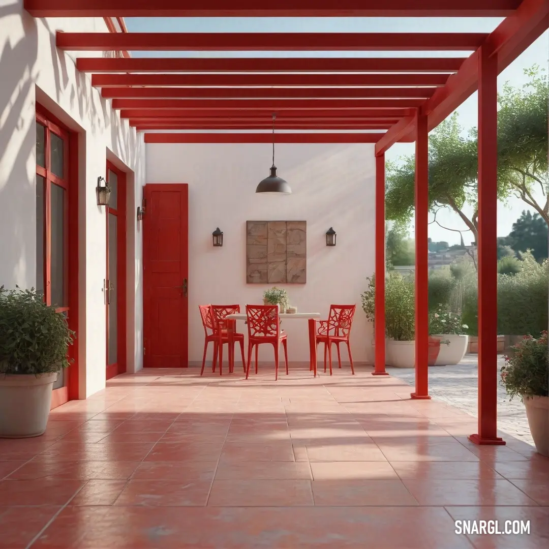 Red patio with a red table and chairs and a red door and a red door. Color CMYK 0,100,100,50.