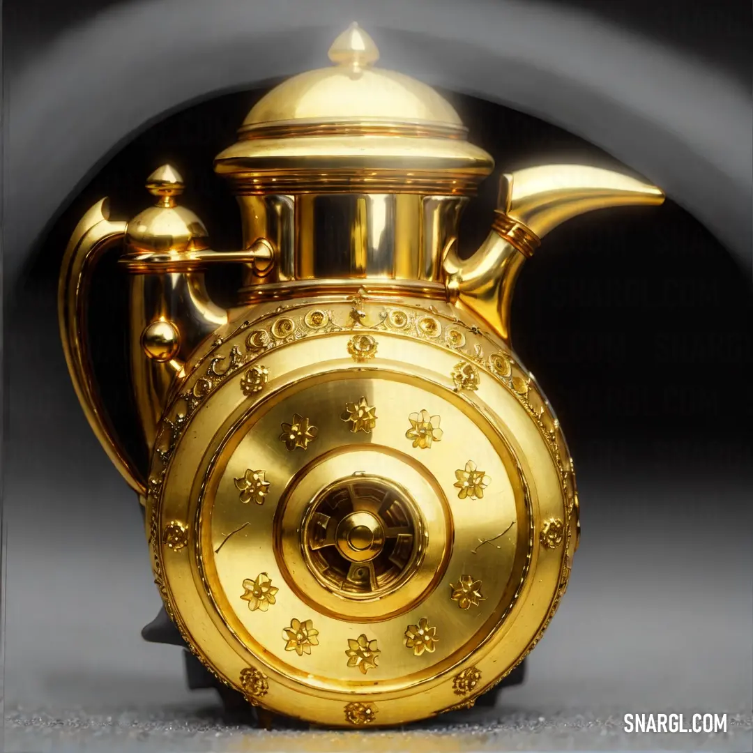 Gold teapot with a circular design on the front of it. Color Meat brown.