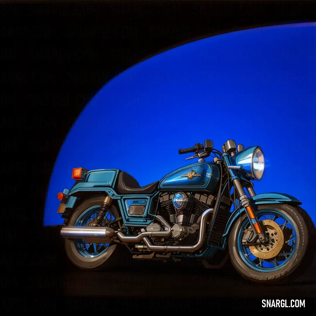 Blue motorcycle parked in a dark room with a blue background and a blue light behind it that is reflecting off of the motorcycle