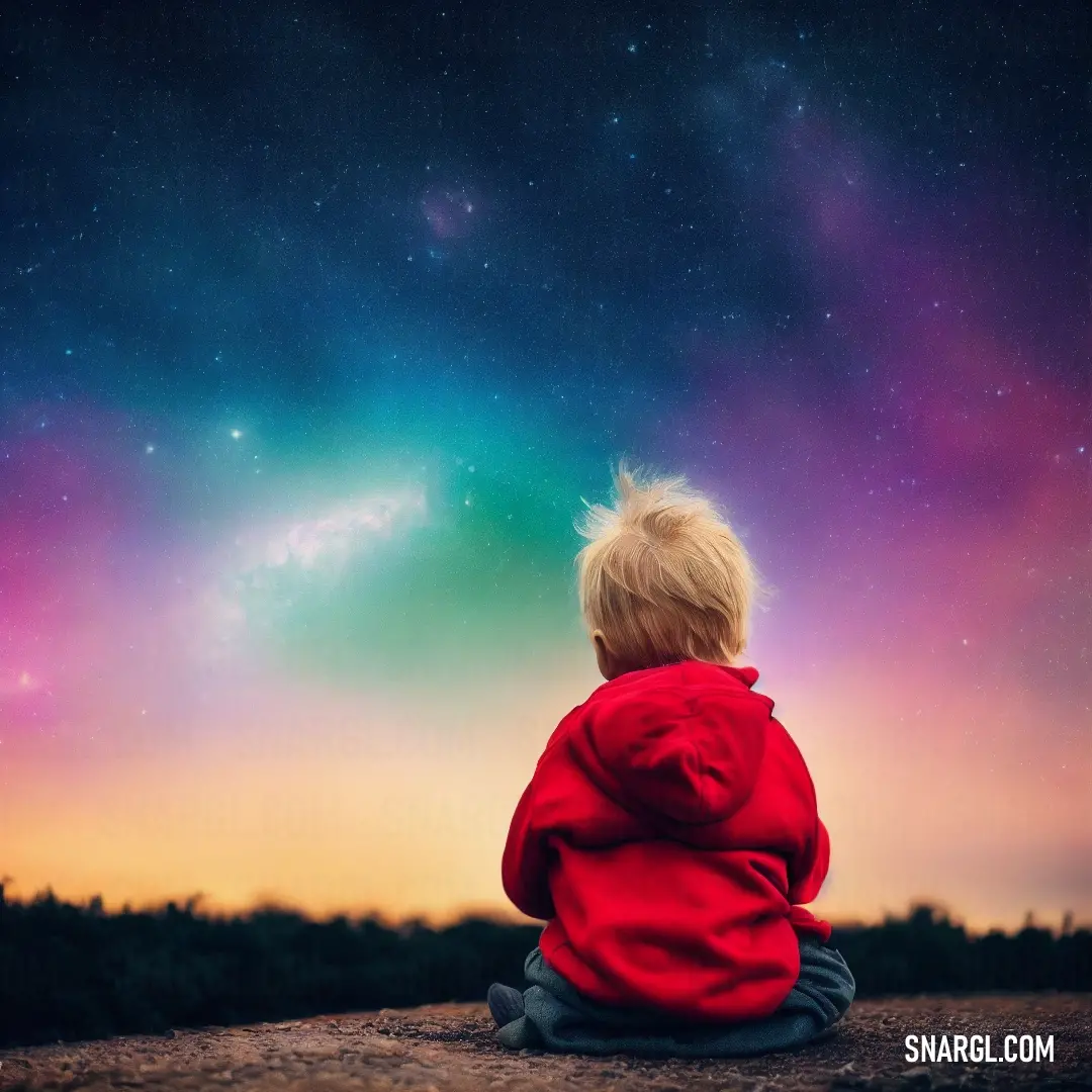 Little boy on a dirt ground looking at the sky with a bright green and purple light in the background