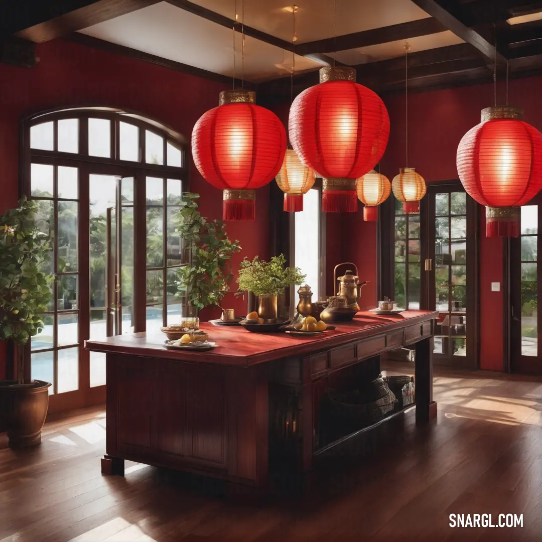 Room with a table and some red lanterns hanging from the ceiling and a table with a potted plant on it. Example of RGB 226,6,44 color.