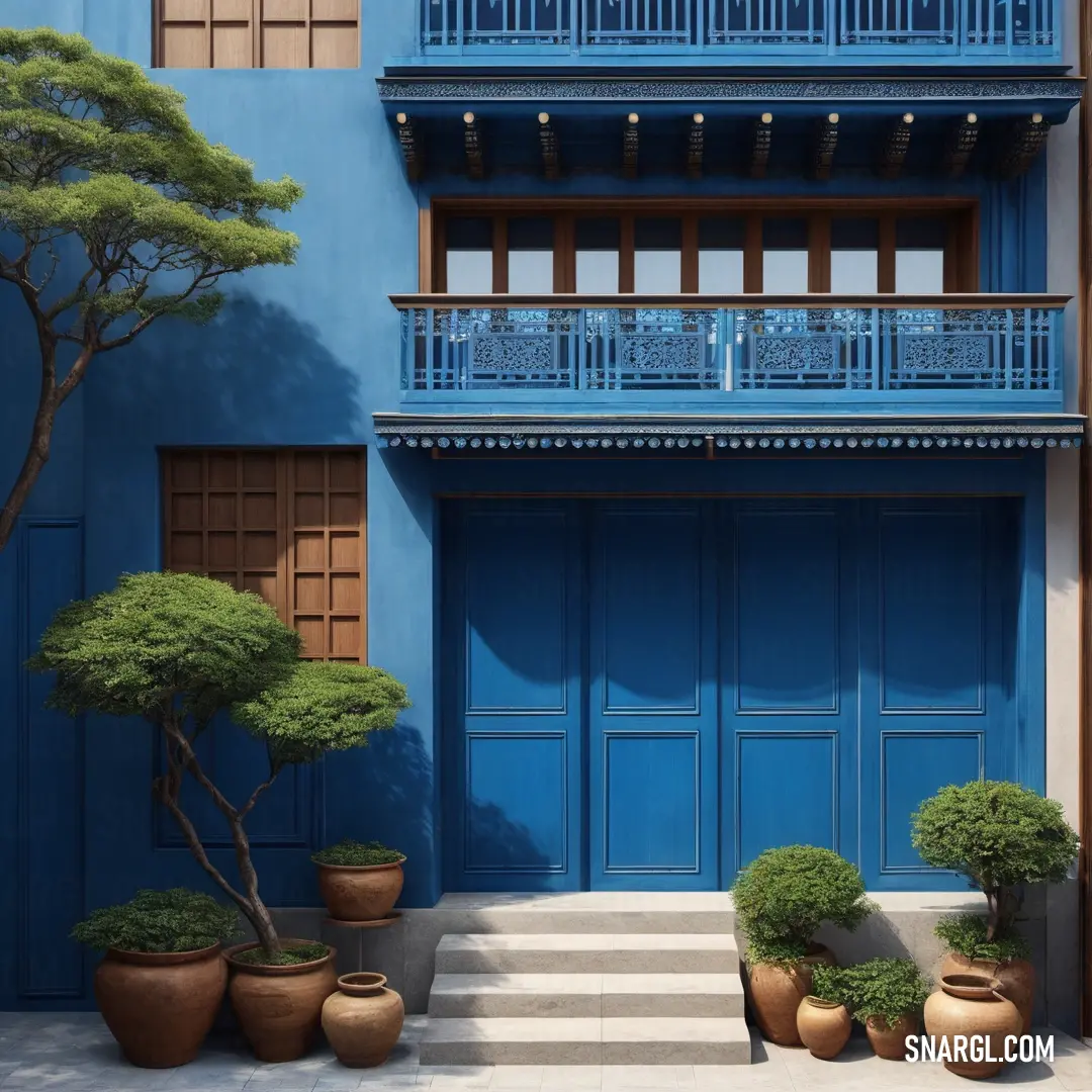 Blue building with a tree and two potted plants in front of it. Color RGB 0,103,165.