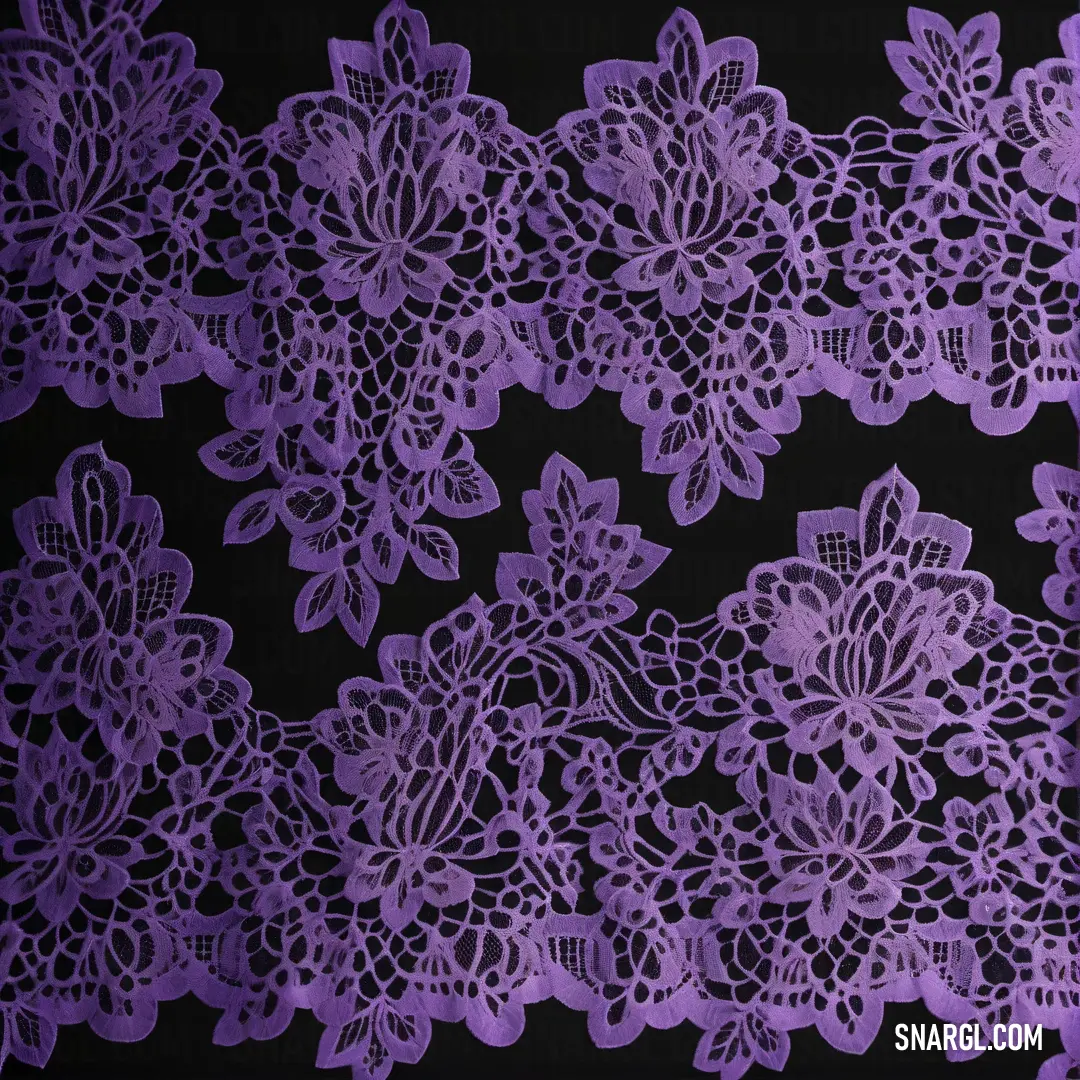 Purple lace with flowers on a black background. Color CMYK 33,49,0,14.