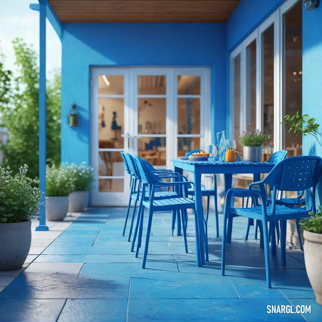 Blue patio with a blue table and chairs and potted plants on the side of the patio. Color #0054B4.