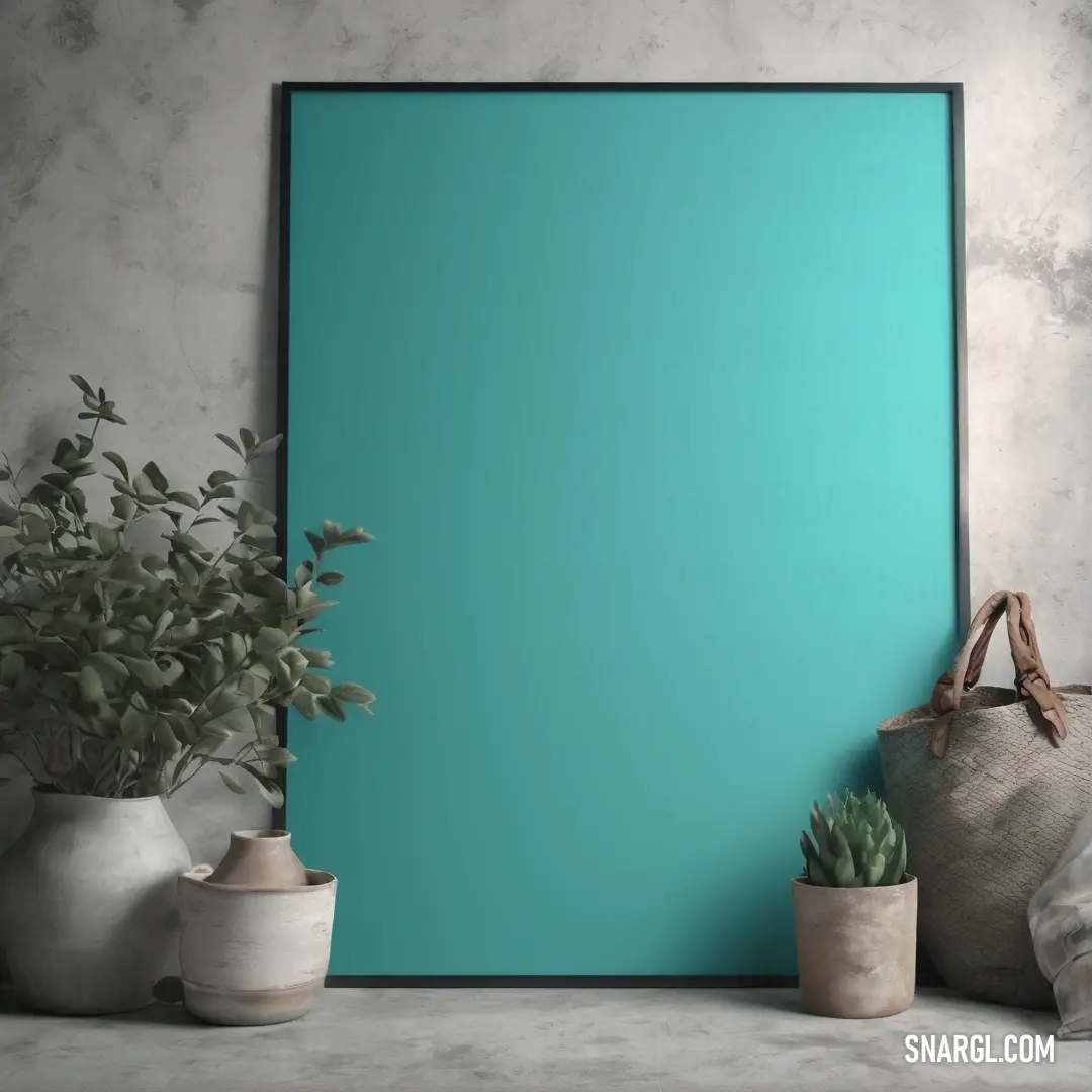 Blue poster frame on top of a table next to potted plants. Example of #48D1CC color.