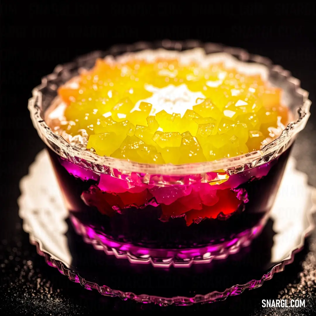 Bowl of jelly with a star on top of it on a plate on a table with a black background