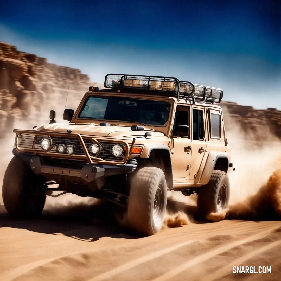 Jeep driving through the desert with dust coming off the tires and tires on it's tires