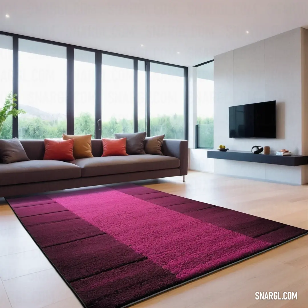 Mulberry color example: Living room with a couch and a large rug in it's center area with a television on the wall