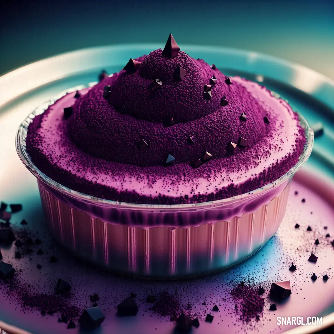 Purple cake on top of a plate on a table with sprinkles on it and a purple frosting