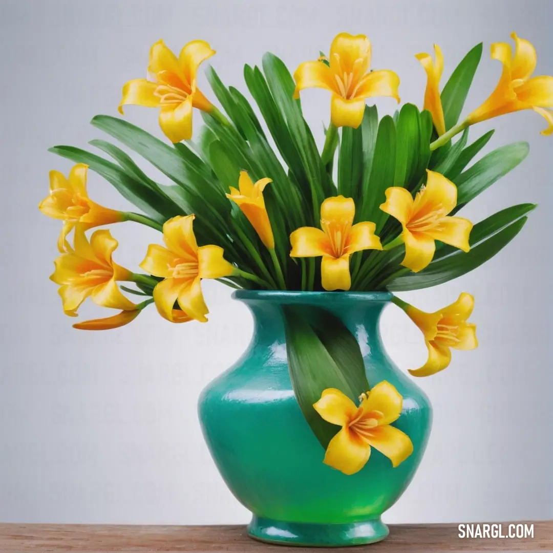 Napier green color. Green vase with yellow flowers in it on a table top with a white background