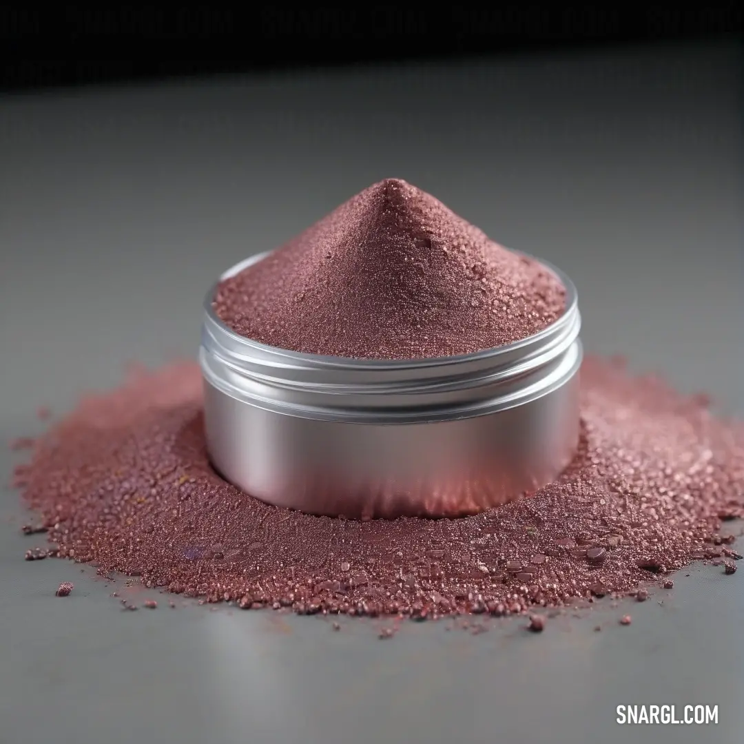 A vivid display of pink powder fills a sleek metal container, resting on a table where the darkness of the background allows its rich RGB 250,253,248 colors to vividly pop and captivate the viewer's eye.