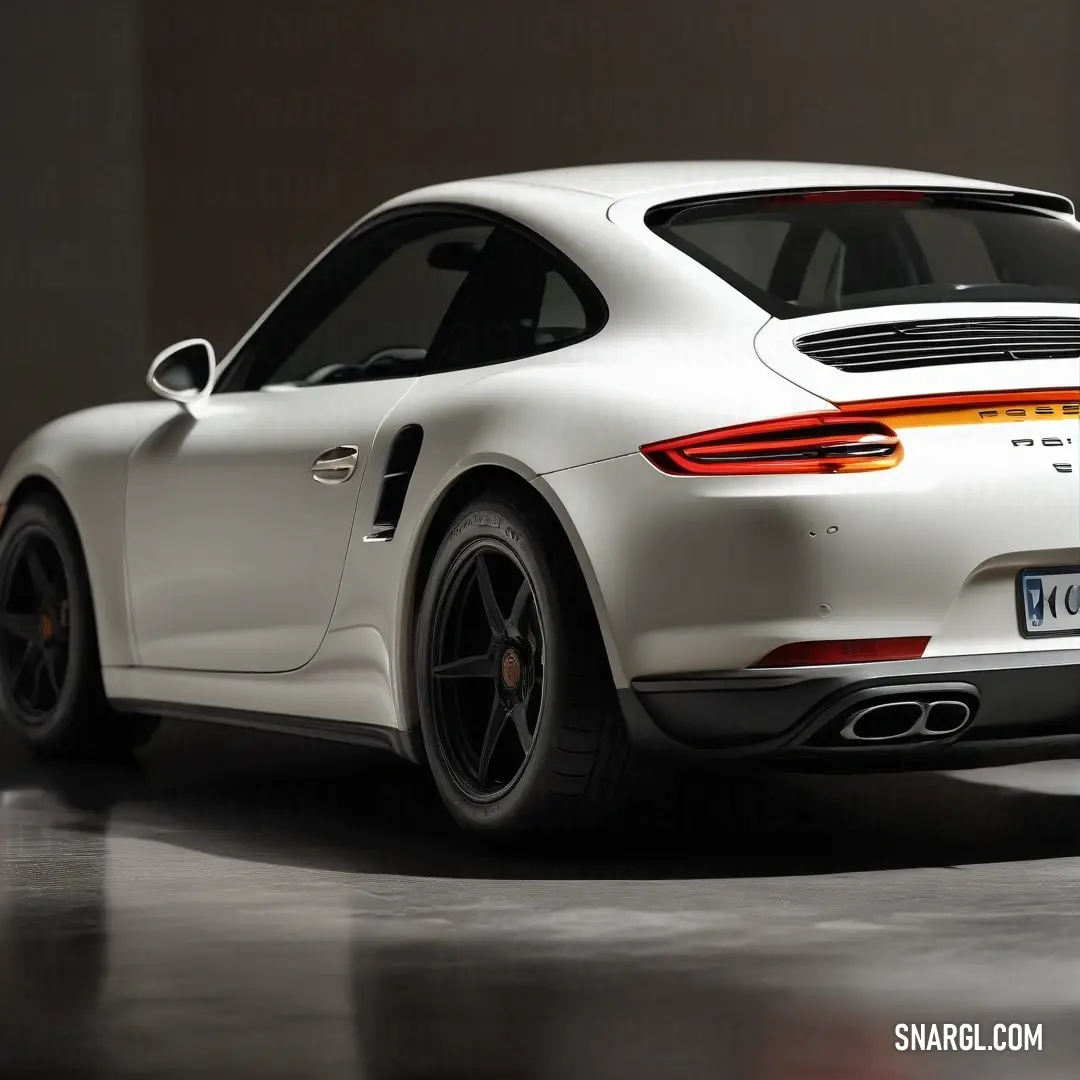 A sleek white Porsche sports car nestled in a modern garage, featuring a polished black floor and walls, emphasizing its stunning design and sleek stature.