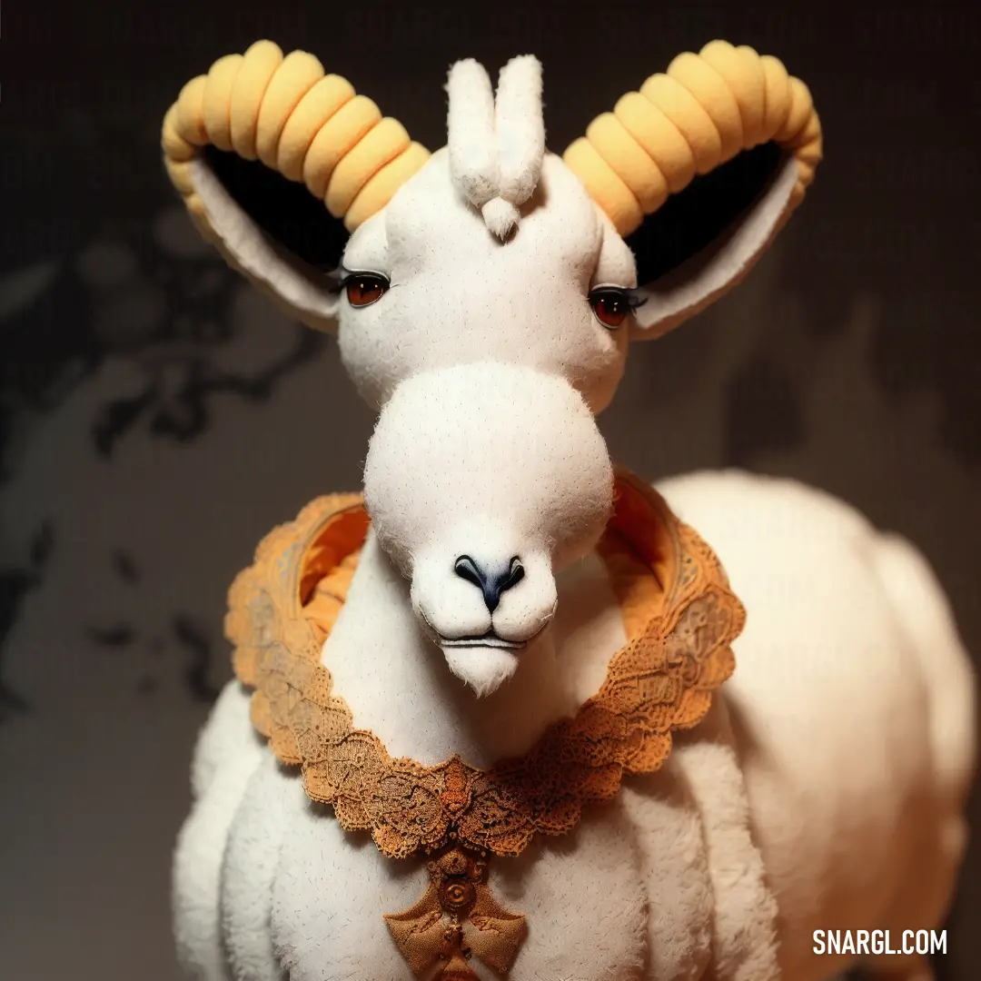 Stuffed animal with a collar around its neck and a goat head on it's back, with a black background. Color RGB 255,242,231.