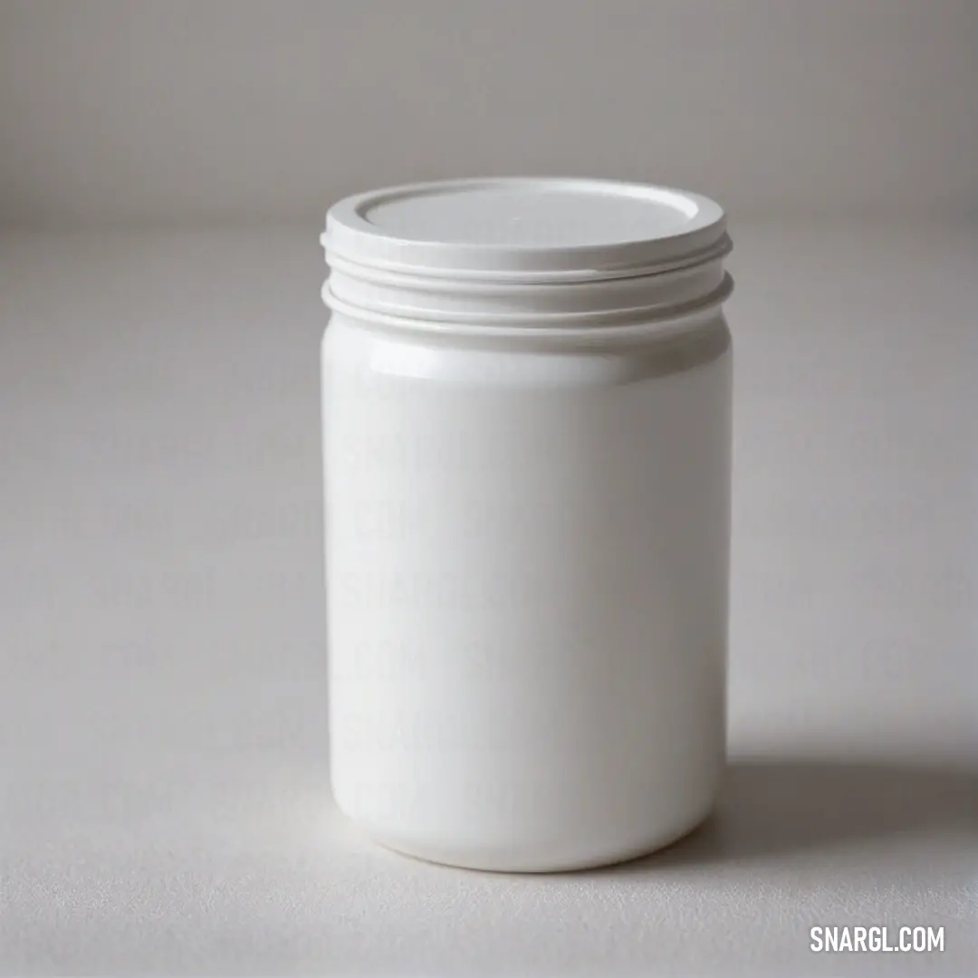 A stylish white jar with a gracefully fitting lid placed on a smooth, white surface, its clean lines and minimalistic appeal radiating modern elegance.