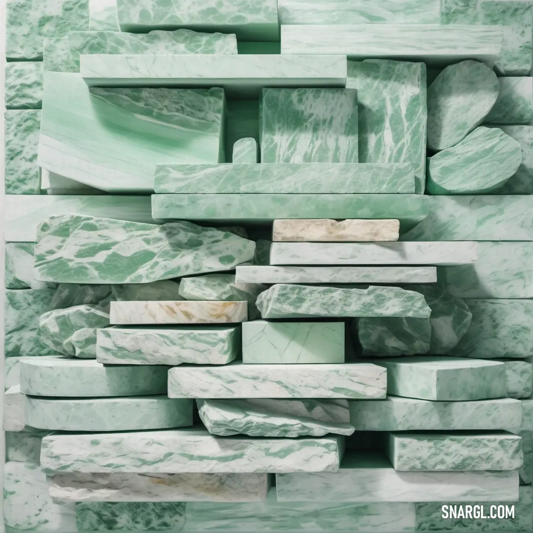 Large stack of green marble blocks stacked on top of each other in a room with a white wall. Color NCS S 0515-B80G.