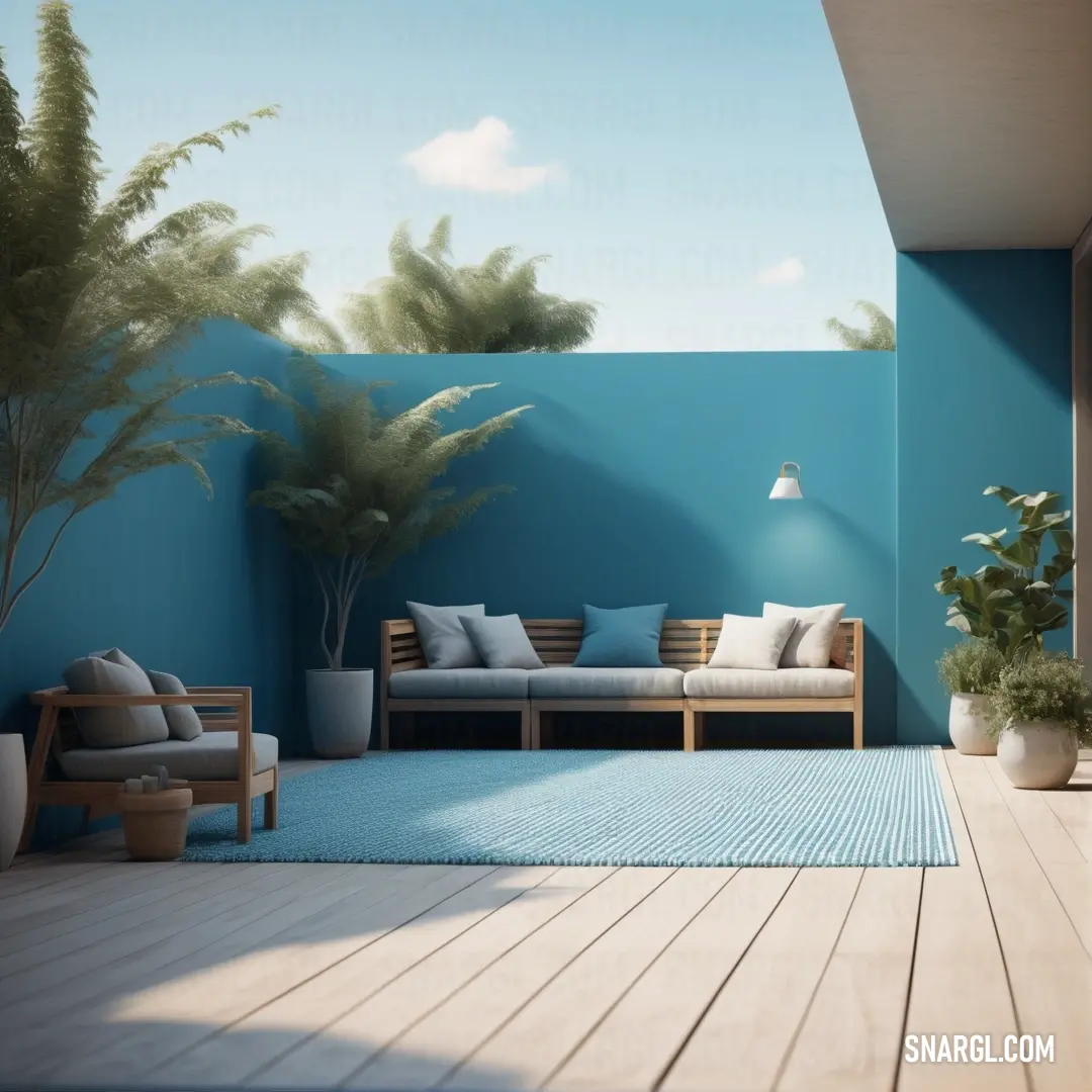 Room with a couch, table and potted plants on the floor and a blue wall with a sky background. Example of NCS S 0520-B10G color.