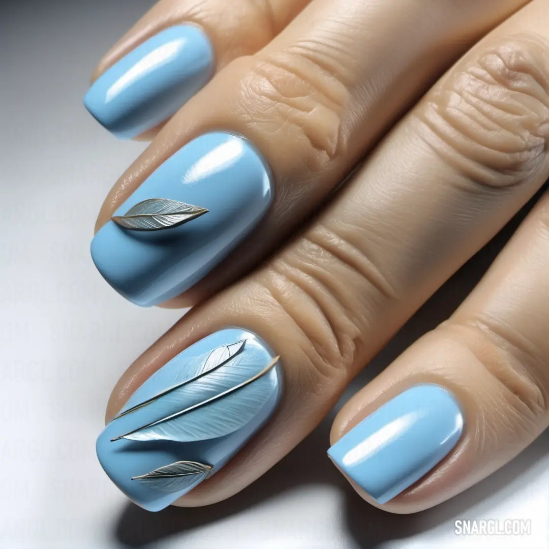 Woman's hand with a blue manicure and a feather on it's tip and a ring of nails. Color NCS S 0530-R80B.