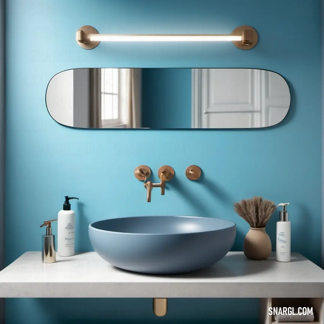 Bathroom with a blue wall and a round sink and mirror above it and a gold faucet. Color #9ED4EB.