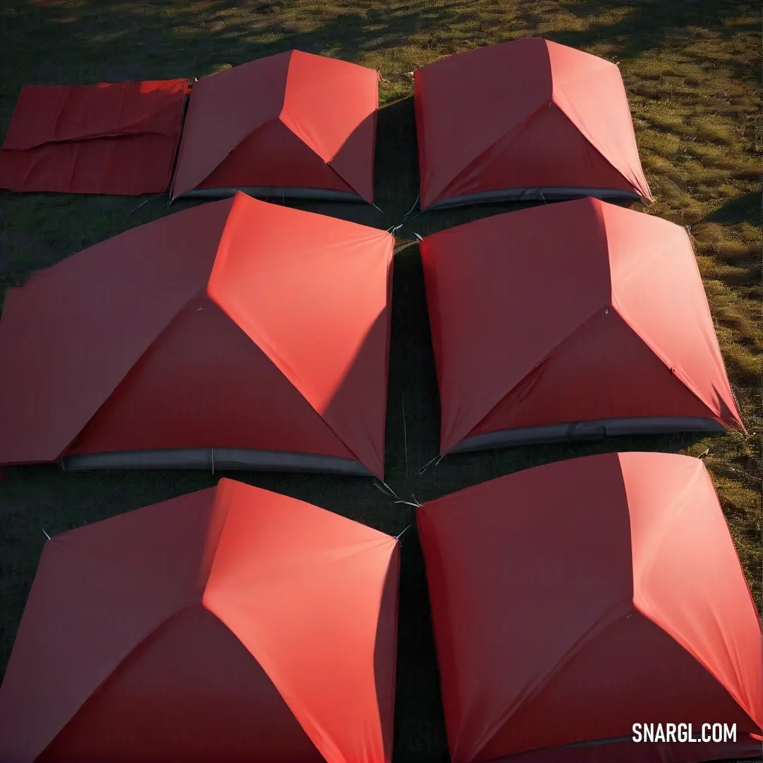 A playful array of red umbrellas sprawls across a grassy backdrop, their vibrant color strikingly contrasting the dark background. This whimsical scene captures the spirit of fun and adventure, inviting laughter and joy in life's little surprises.